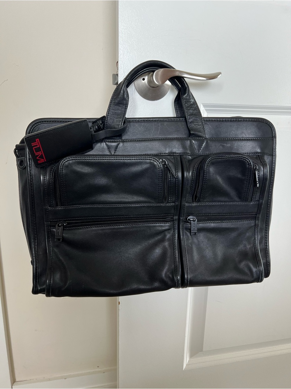 Tumi Black Leather Briefcase with Dual Front Zip Pockets